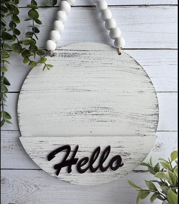 62cb59c93e05481e760dec35_round-hello-white_1775745152520.jpg
